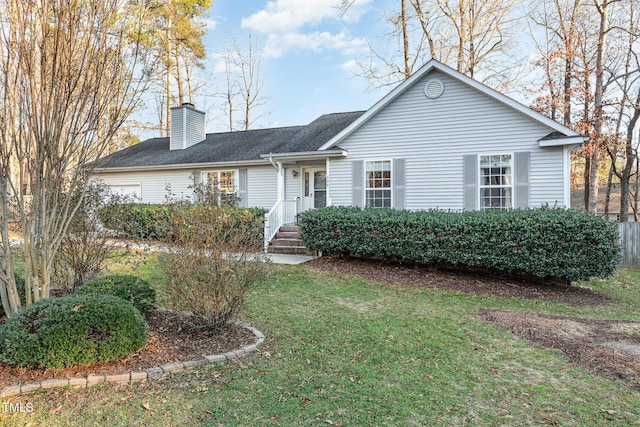 single story home with a front lawn