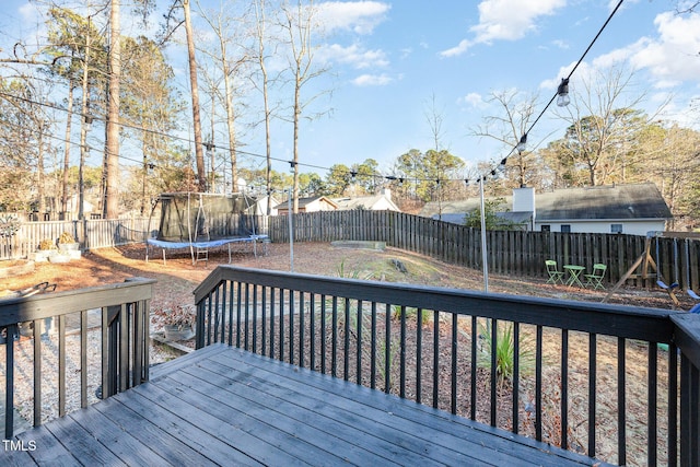 wooden deck with a trampoline