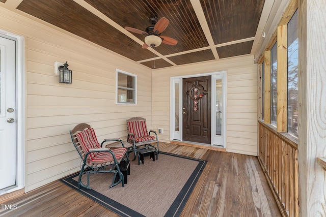 property entrance with ceiling fan and a porch