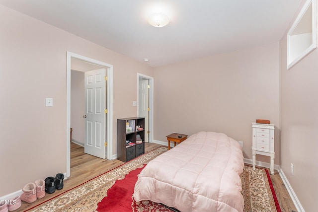 bedroom with light hardwood / wood-style flooring