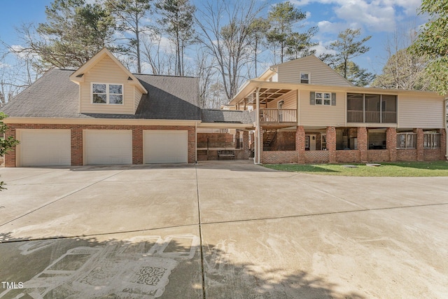 view of front facade with a balcony and a garage