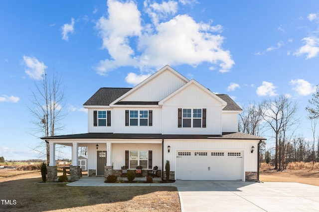 view of front of property featuring a garage and covered porch