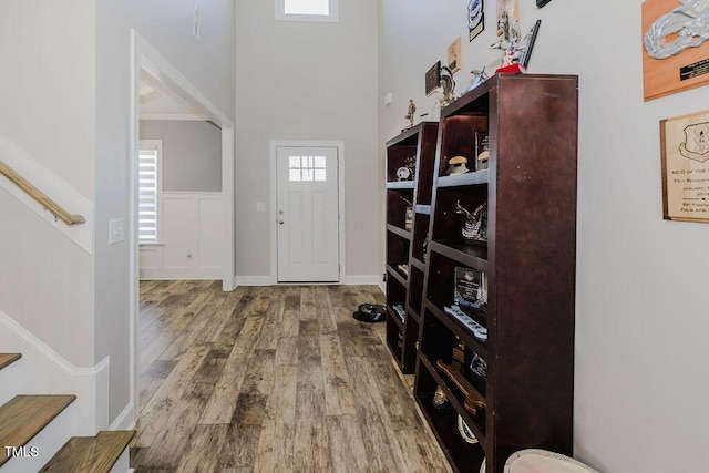 entryway with hardwood / wood-style flooring