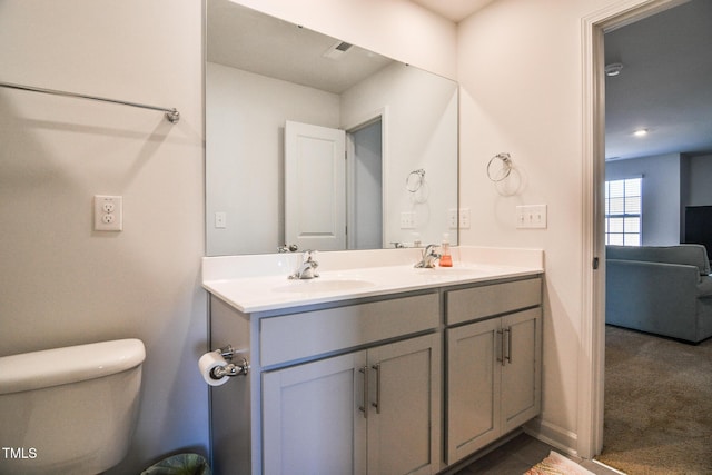 bathroom with vanity and toilet