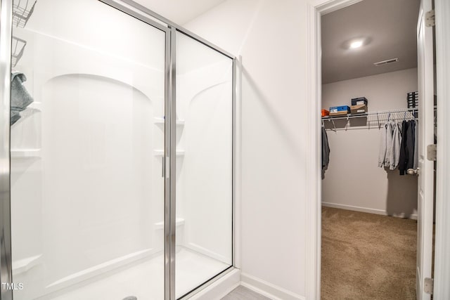 bathroom featuring an enclosed shower