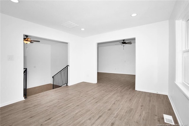 spare room featuring light hardwood / wood-style flooring and ceiling fan