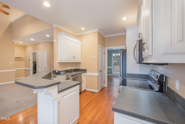 kitchen featuring appliances with stainless steel finishes, white cabinetry, light wood-type flooring, and kitchen peninsula