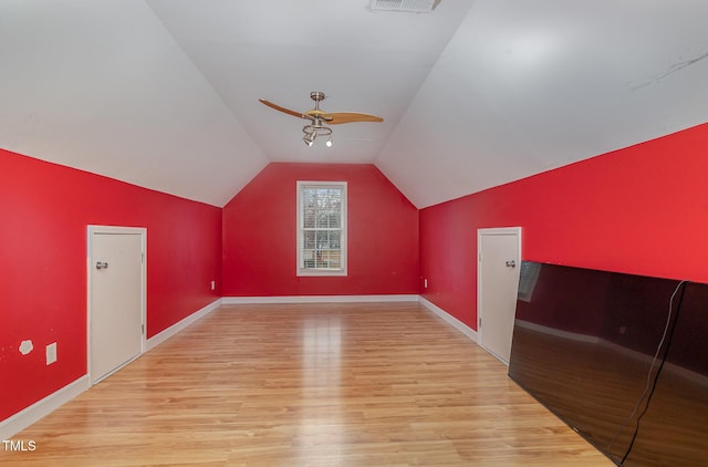 additional living space with lofted ceiling, ceiling fan, and light hardwood / wood-style floors