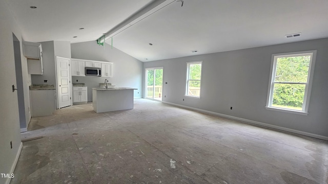 121 Tanglewood Dr Unit 8-J, Louisburg, NC 27549 - unfurnished living room with a sink and baseboards
