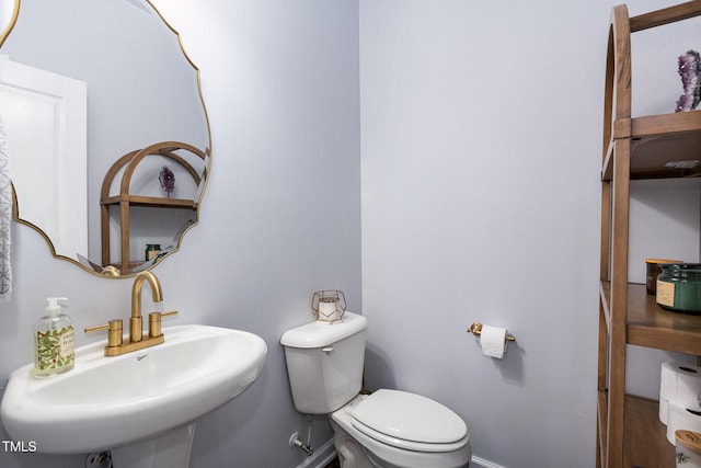 bathroom with sink and toilet