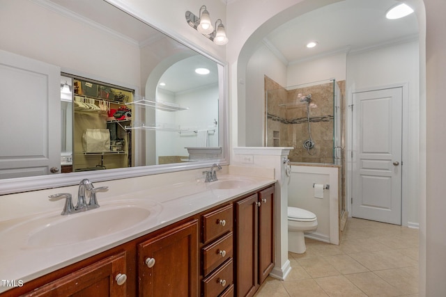 bathroom with vanity, tile patterned flooring, toilet, ornamental molding, and an enclosed shower