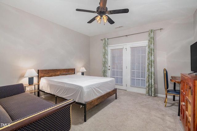 bedroom featuring access to outside, ceiling fan, and light carpet