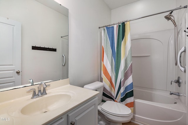 full bathroom featuring vanity, shower / tub combo, and toilet