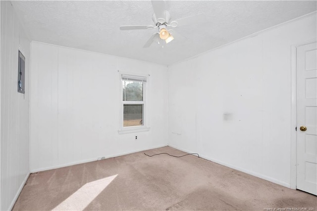 carpeted spare room with ceiling fan and a textured ceiling