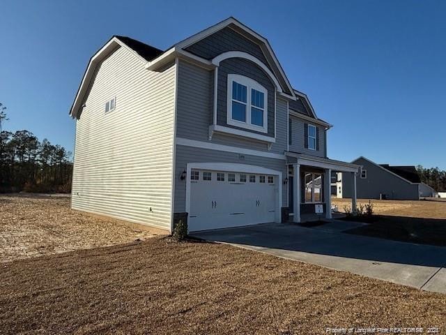 view of front of home featuring driveway and an attached garage