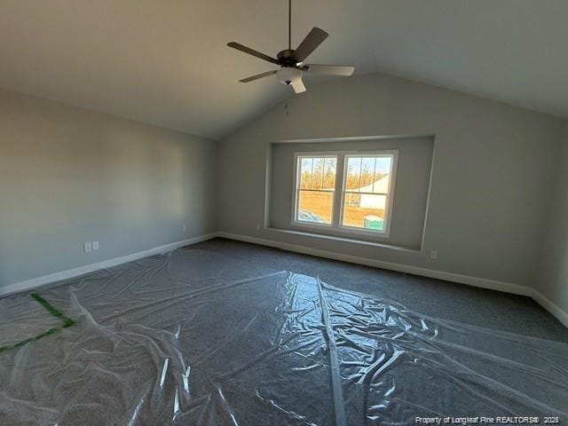 bonus room featuring vaulted ceiling, ceiling fan, and baseboards