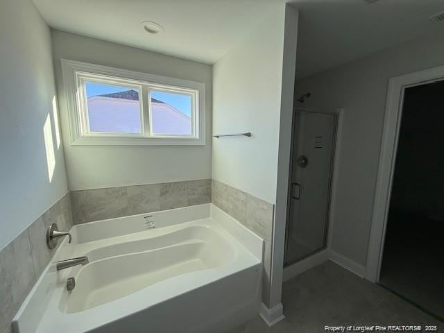 bathroom with a stall shower, visible vents, a garden tub, and tile patterned floors