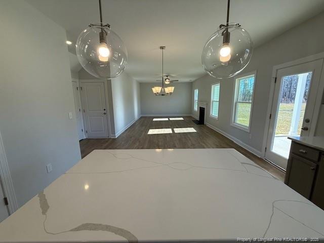 dining room with baseboards and wood finished floors