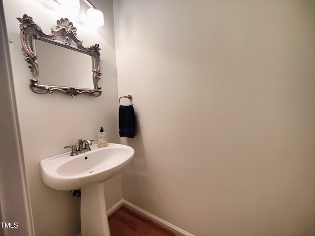 bathroom with hardwood / wood-style floors