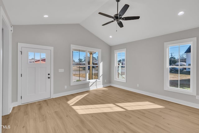 entrance foyer featuring a wealth of natural light, light hardwood / wood-style flooring, ceiling fan, and lofted ceiling