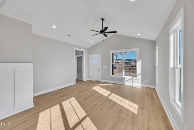 unfurnished living room with light wood-type flooring, ceiling fan, and lofted ceiling