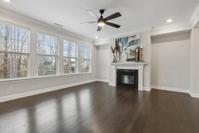 unfurnished living room featuring crown molding, dark hardwood / wood-style floors, and ceiling fan