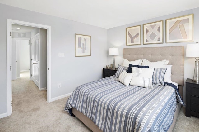 bedroom with light colored carpet