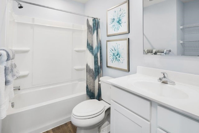 full bathroom with hardwood / wood-style flooring, vanity, toilet, and shower / tub combo with curtain