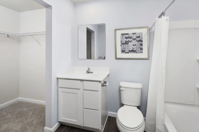 full bathroom with shower / tub combo, vanity, and toilet