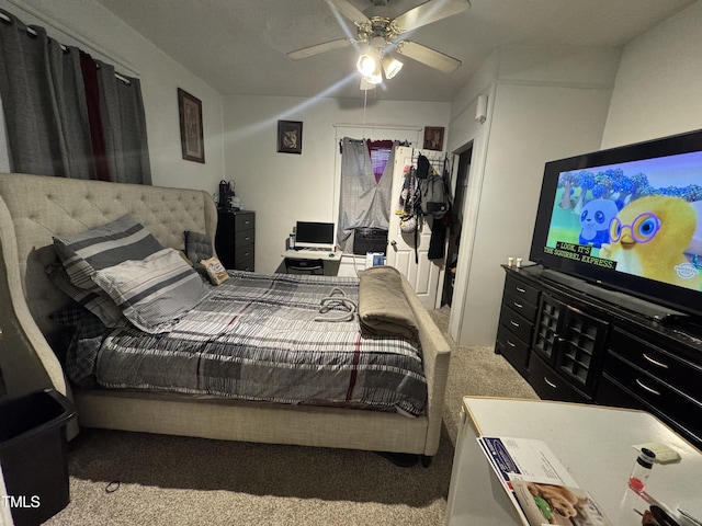 bedroom featuring light colored carpet and ceiling fan