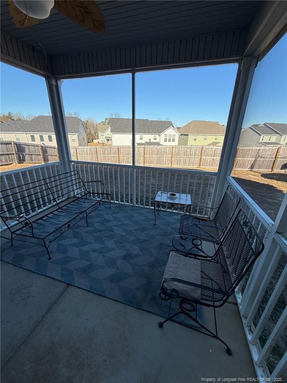 view of patio / terrace with a fenced backyard and a residential view