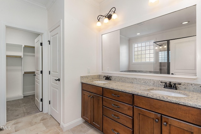 bathroom featuring vanity, ornamental molding, and walk in shower