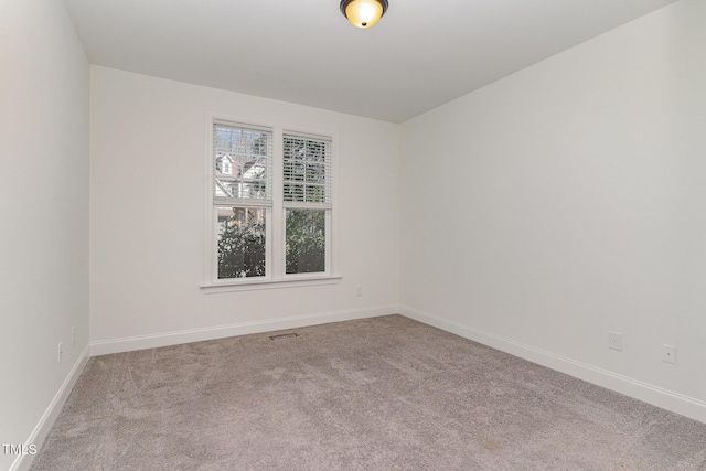 empty room featuring light colored carpet