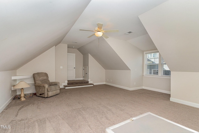 additional living space with vaulted ceiling, ceiling fan, and carpet