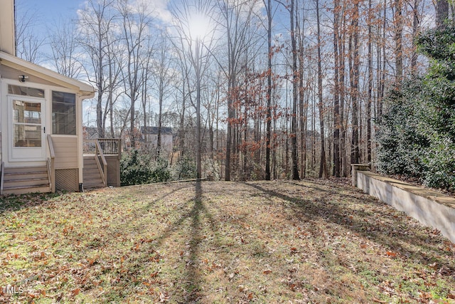 view of yard with a sunroom