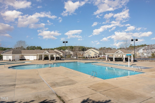 view of swimming pool featuring a gazebo and a patio area