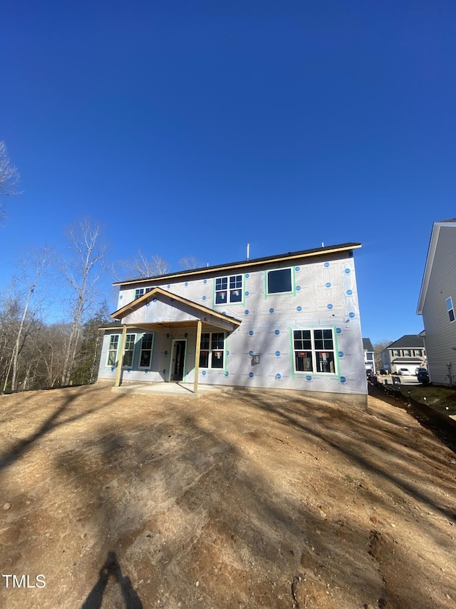 back of house with a patio