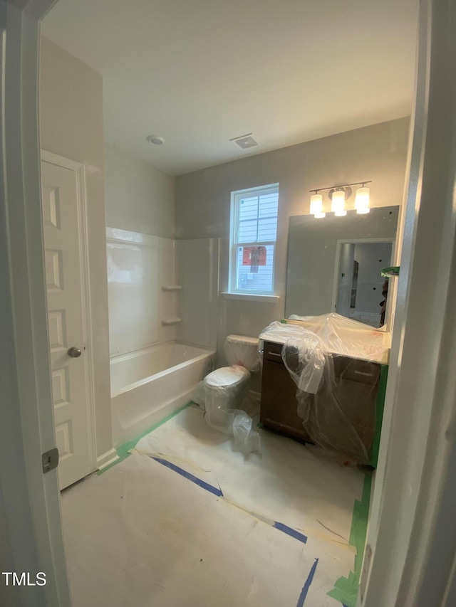 bathroom with visible vents, toilet, and vanity