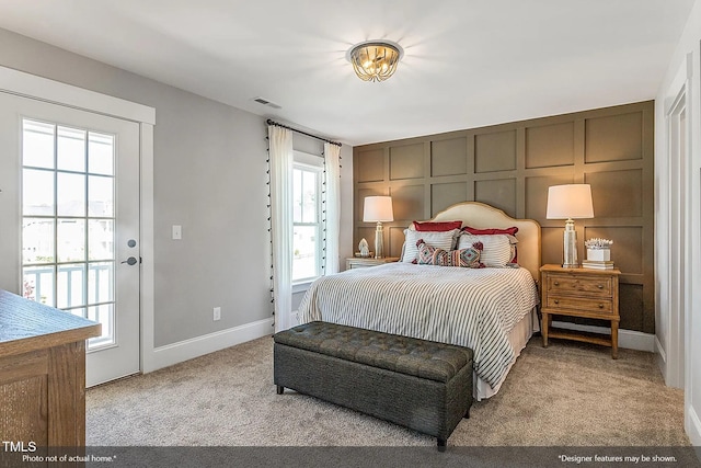 bedroom with visible vents, carpet floors, and baseboards