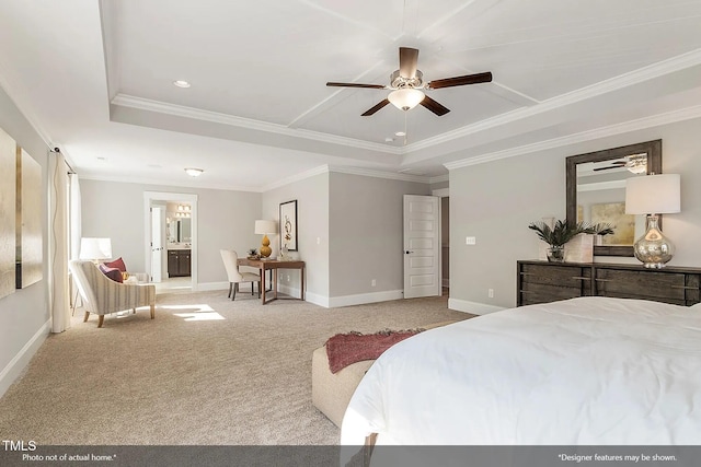 carpeted bedroom with baseboards, a tray ceiling, ornamental molding, recessed lighting, and ensuite bathroom