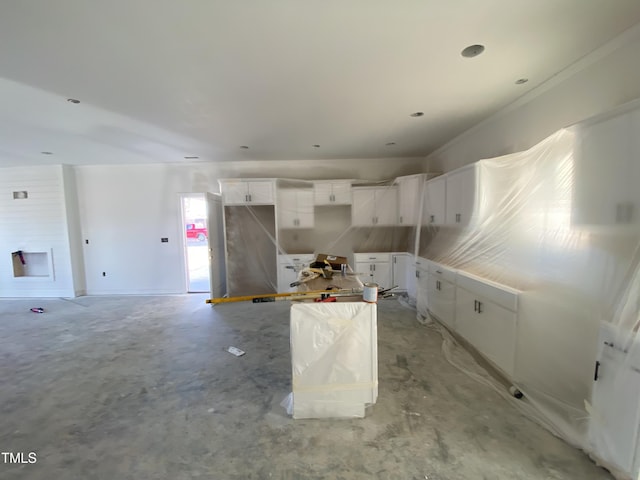 kitchen with white cabinetry and a center island