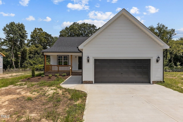 ranch-style house with a front lawn, covered porch, and a garage