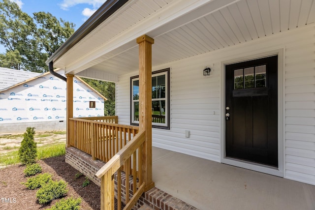 doorway to property with a porch