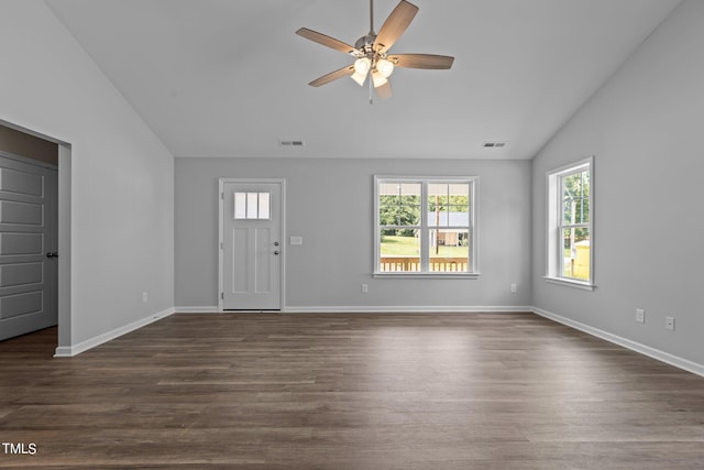 entryway with dark hardwood / wood-style floors, ceiling fan, and vaulted ceiling