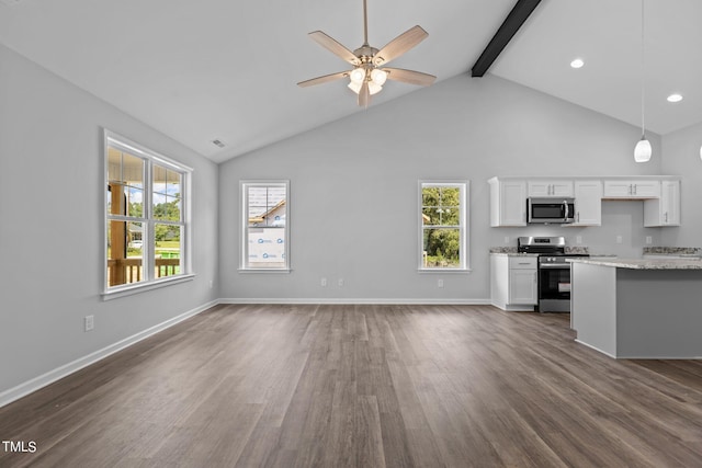 unfurnished living room with beam ceiling, high vaulted ceiling, ceiling fan, and dark wood-type flooring