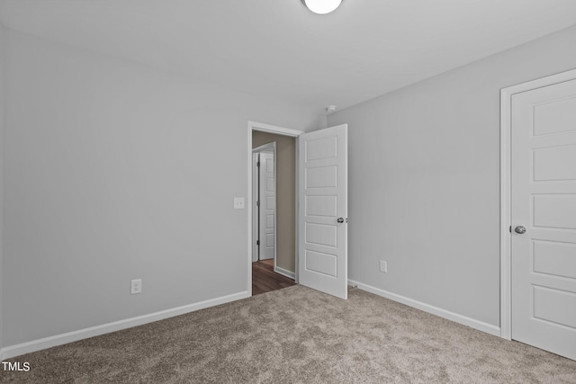 unfurnished bedroom with carpet flooring