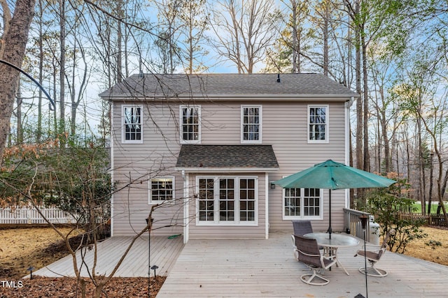 back of house featuring a deck