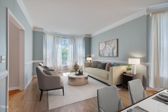 living room featuring light wood-type flooring and ornamental molding