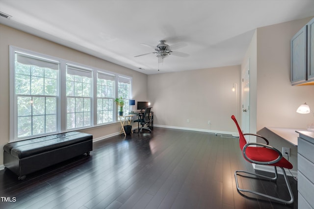 office area with ceiling fan and dark hardwood / wood-style floors