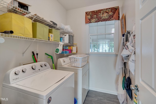 laundry area with washing machine and clothes dryer and dark hardwood / wood-style flooring